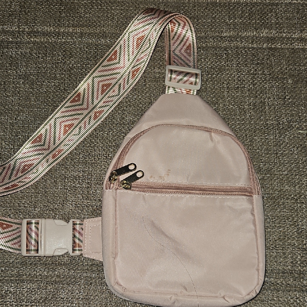 Stylish Pink Crossbody Bag with Patterned Strap